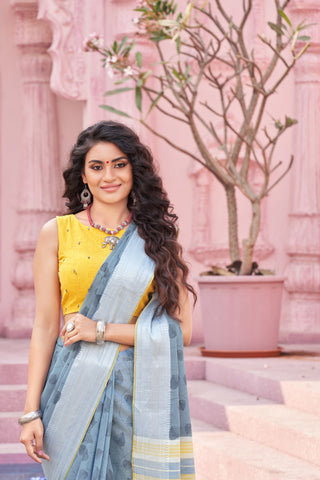 Pale yellow mangalagiri cotton saree with leaves handprint.