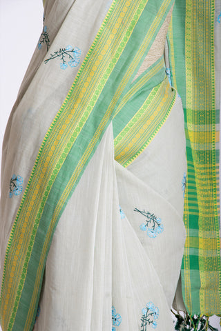 Chettinadu cotton saree in Bone mist with flower design hand embroidered.