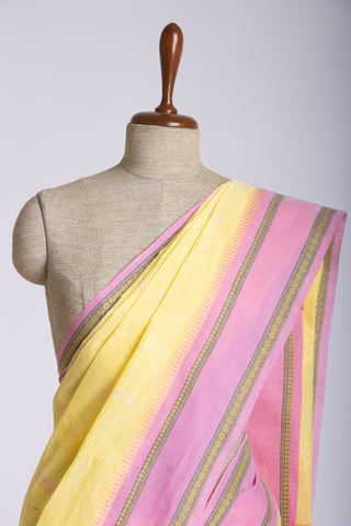 Chettinadu cotton saree  with yellow color branches and pink color flower hand embroidery.