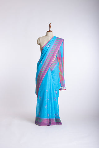 Kanchi cotton saree with Blue color branches  and pink color flower hand embroidery.