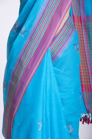 Kanchi cotton saree with Blue color branches  and pink color flower hand embroidery.