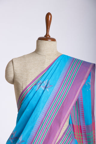 Kanchi cotton saree with Blue color branches  and pink color flower hand embroidery.