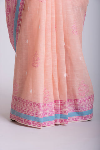 Kanchi cotton saree with Blue color branches  and pink color flower hand embroidery.