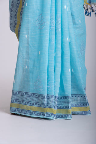 Kanchi cotton saree with Blue color branches  and pink color flower hand embroidery.