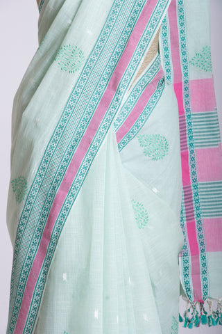 Kanchi cotton saree with Blue color branches  and pink color flower hand embroidery.