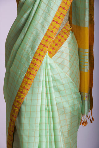 Mangalagiri Silk Sarees With All Over Checks And Printed Border.