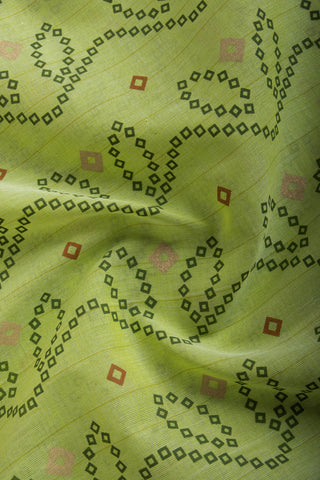 Kollam Cotton saree with lime green hand printed with Bandhani patterned design.