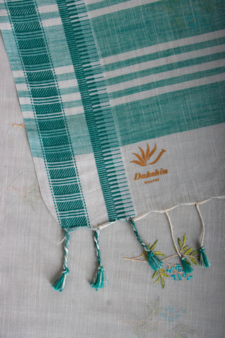 Classic Grey colour khadi cotton saree with hand embroidery motifs.