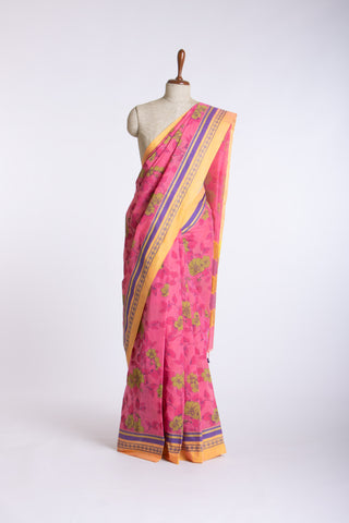 Kanchi Cotton saree in bright pink color with floral print.