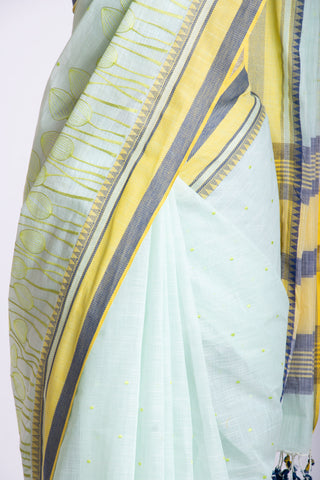 Alikam Khadi cotton saree in baby blue with lotus buds design hand embroidered.