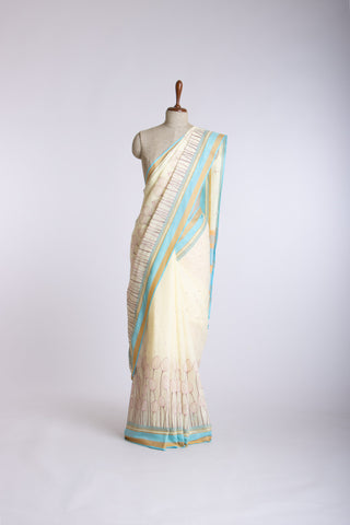 Alikam Khadi cotton saree in baby blue with lotus buds design hand embroidered.