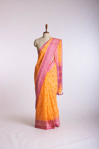 Chettinadu cotton saree in Pumpkin Orange with floral print in the body