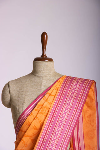 Chettinadu cotton saree in Pumpkin Orange with floral print in the body