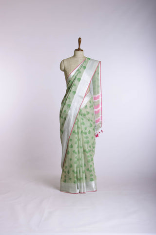 Pale yellow mangalagiri cotton saree with leaves handprint.