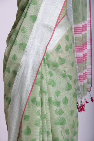 Pale yellow mangalagiri cotton saree with leaves handprint.