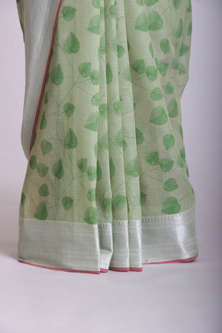 Pale yellow mangalagiri cotton saree with leaves handprint.