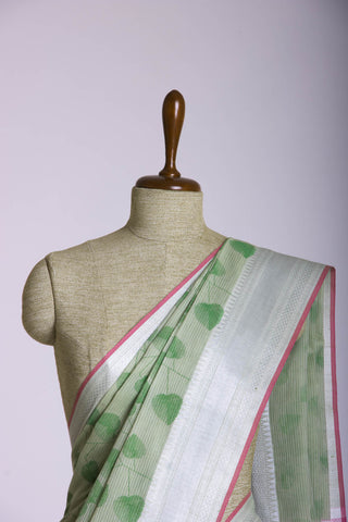 Pale yellow mangalagiri cotton saree with leaves handprint.