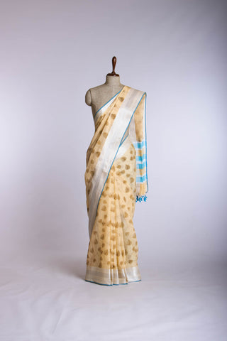 Pale yellow mangalagiri cotton saree with leaves handprint.