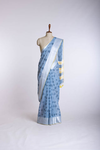 Pale yellow mangalagiri cotton saree with leaves handprint.