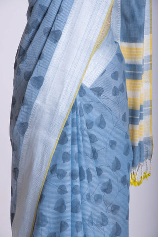 Pale yellow mangalagiri cotton saree with leaves handprint.