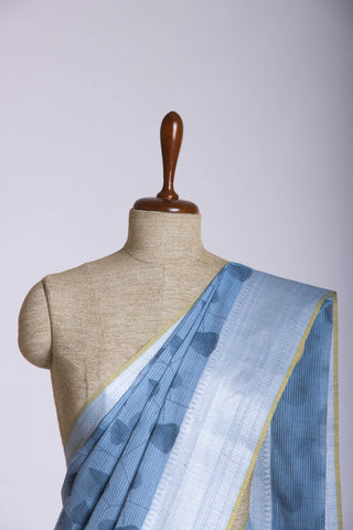 Pale yellow mangalagiri cotton saree with leaves handprint.