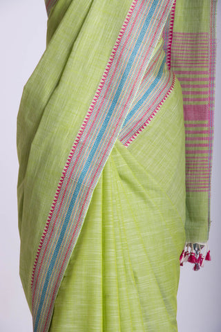 Alikam Khadi Cotton saree  in lime green with white slub texture.
