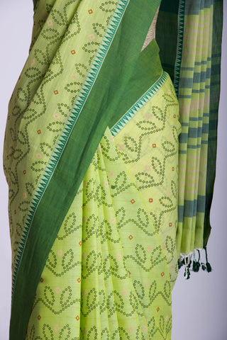 Kollam Cotton saree with lime green hand printed with Bandhani patterned design.