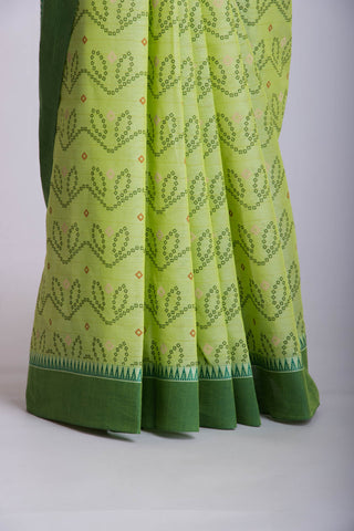 Kollam Cotton saree with lime green hand printed with Bandhani patterned design.