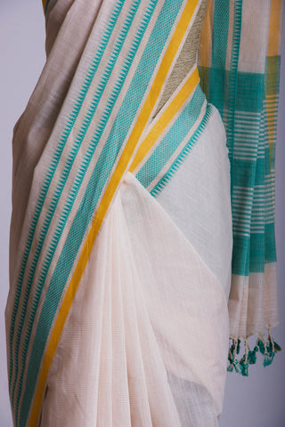 Kanchi Cotton saree  in pale yellow  with simple plain texture.