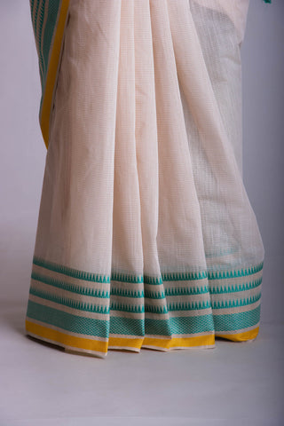 Kanchi Cotton saree  in pale yellow  with simple plain texture.