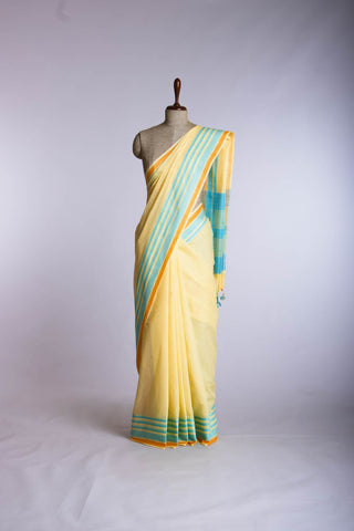 Kanchi Cotton saree  in pale yellow  with simple plain texture.