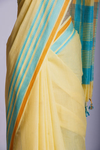 Kanchi Cotton saree  in pale yellow  with simple plain texture.