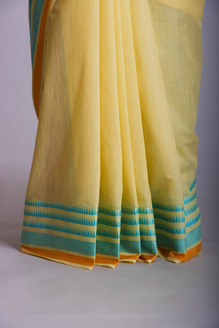 Kanchi Cotton saree  in pale yellow  with simple plain texture.