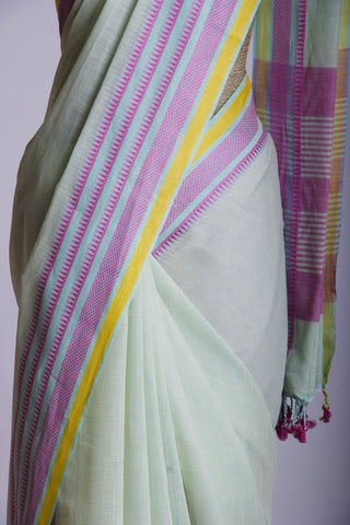 Kanchi Cotton saree  in pale yellow  with simple plain texture.