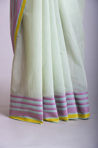 Kanchi Cotton saree  in pale yellow  with simple plain texture.