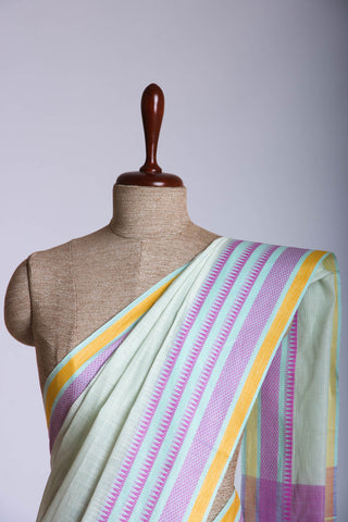 Kanchi Cotton saree  in pale yellow  with simple plain texture.