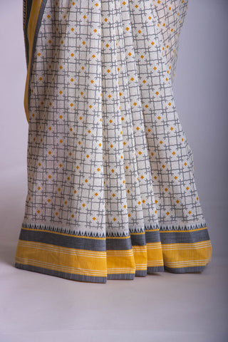 Kanchi Cotton saree  in Off white with geometric pattern hand printed.