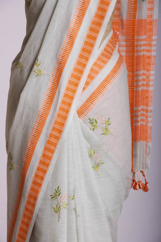 Classic Grey colour khadi cotton saree with hand embroidery motifs.