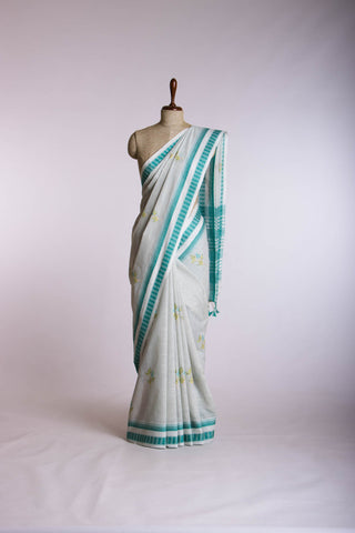 Classic Grey colour khadi cotton saree with hand embroidery motifs.