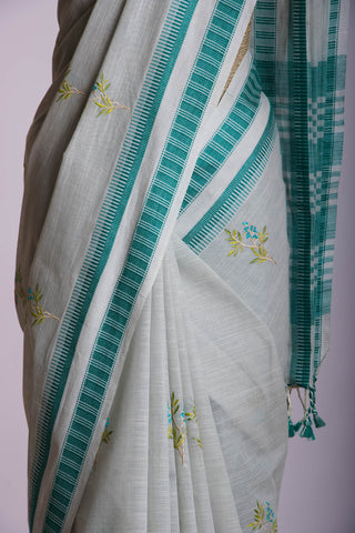 Classic Grey colour khadi cotton saree with hand embroidery motifs.