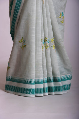 Classic Grey colour khadi cotton saree with hand embroidery motifs.