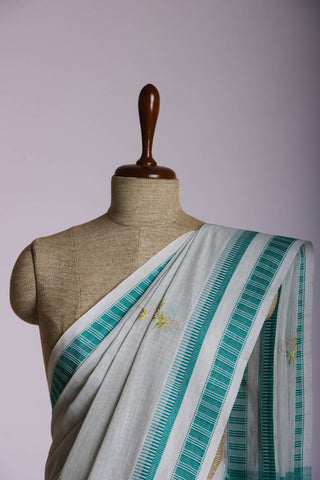 Classic Grey colour khadi cotton saree with hand embroidery motifs.