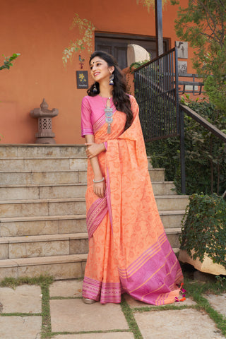 Chettinadu cotton saree in Pumpkin Orange with floral print in the body