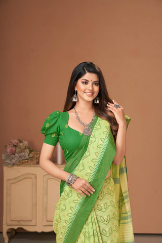 Kollam Cotton saree with lime green hand printed with Bandhani patterned design.