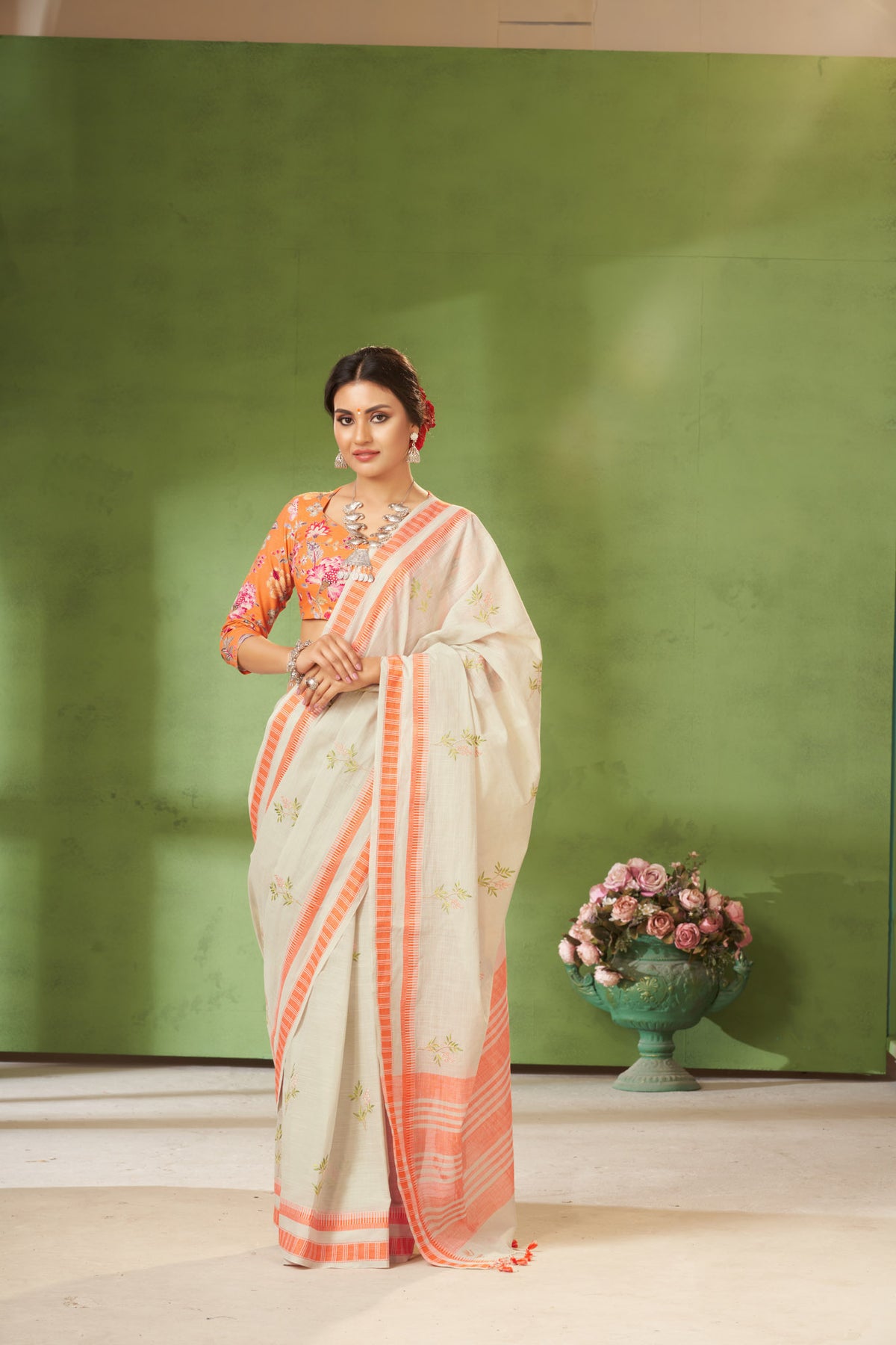 Classic Grey colour khadi cotton saree with hand embroidery motifs.